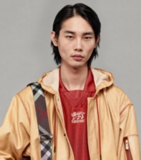 Model wearing Twill Parka in Rust with Striped Jersey Top  