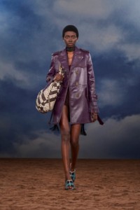 Burberry SS26 Show model Binta Diop wearing a Fringed leather trench coat and a Check leather Bridle tote
