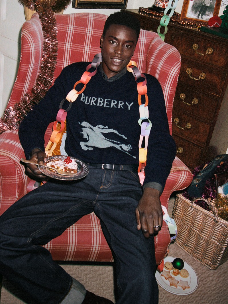 Burberry Festive Campaign featuring a model wearing the Men's EKD Wool Cashmere Sweater in black​.