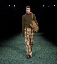 Model in Fringed wool sweater in furrow