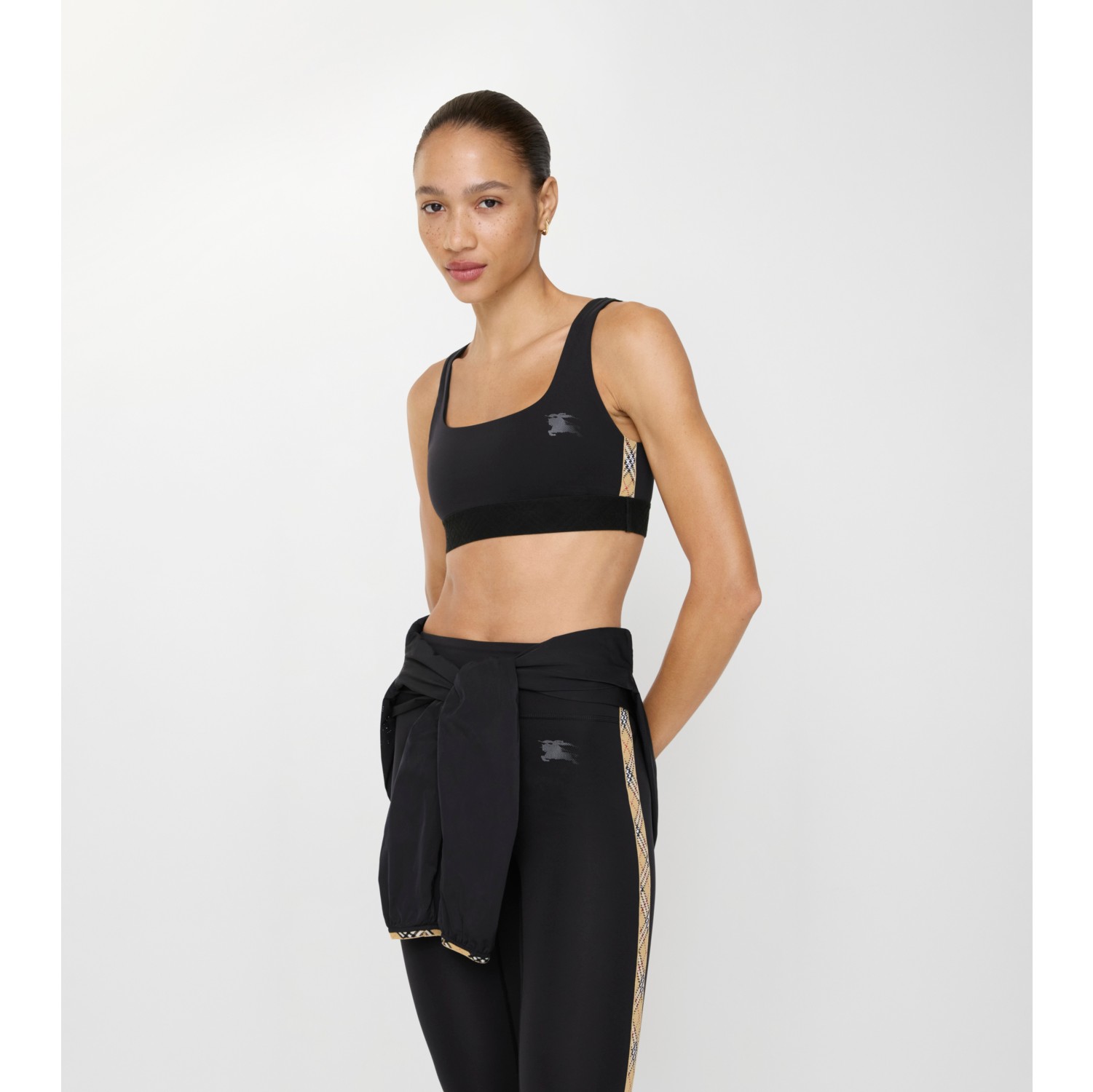 Top sportivo in nylon stretch con finiture Check