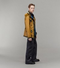 Model wearing Field Jacket with B Shield Striped Jersey Rugby Shirt and Zip Trousers in Charcoal