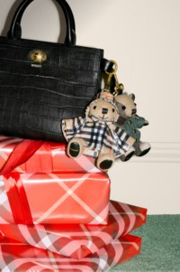 Burberry Festive 2025 Campaign featuring the new Cotswolds bag in colour black with two bear charms.