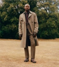 Shot of model wearing mid length Burberry Trench Coat