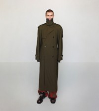 Model in green Trench Coat with Check trousers