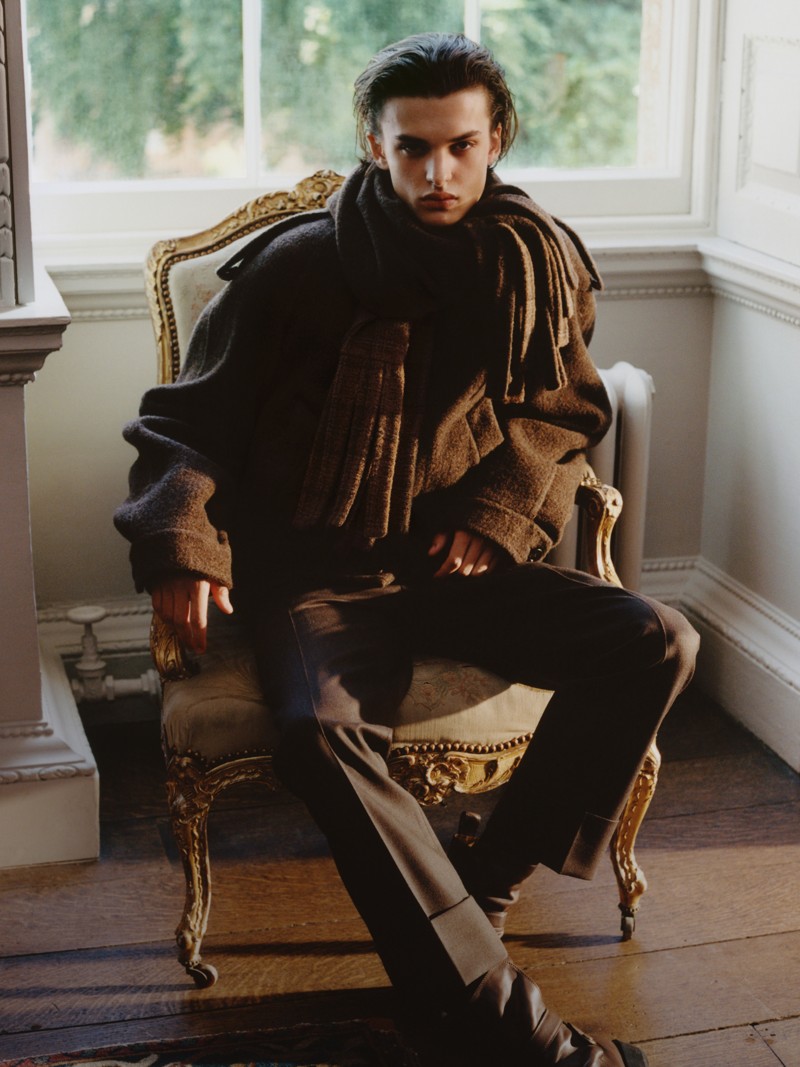 Shot of model wearing Mid-length Cashmere Car Coat in colour Cog brown melange, with Burberry scarf