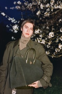 Bright holding Burberry Bag for Rocking Horse Bag Campaign
