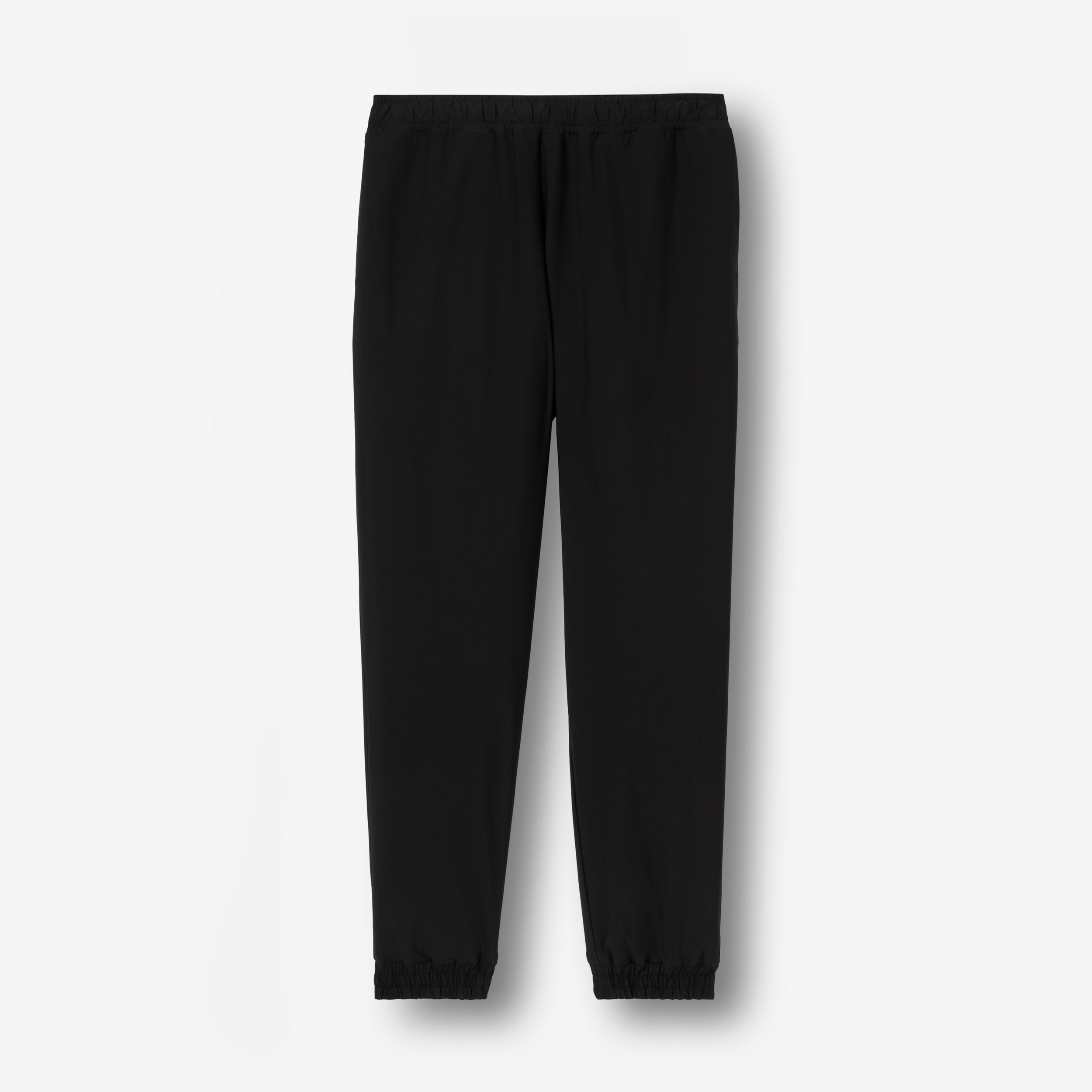 Logo Print Stretch Nylon Trousers in Black - Men | Burberry® Official - 1