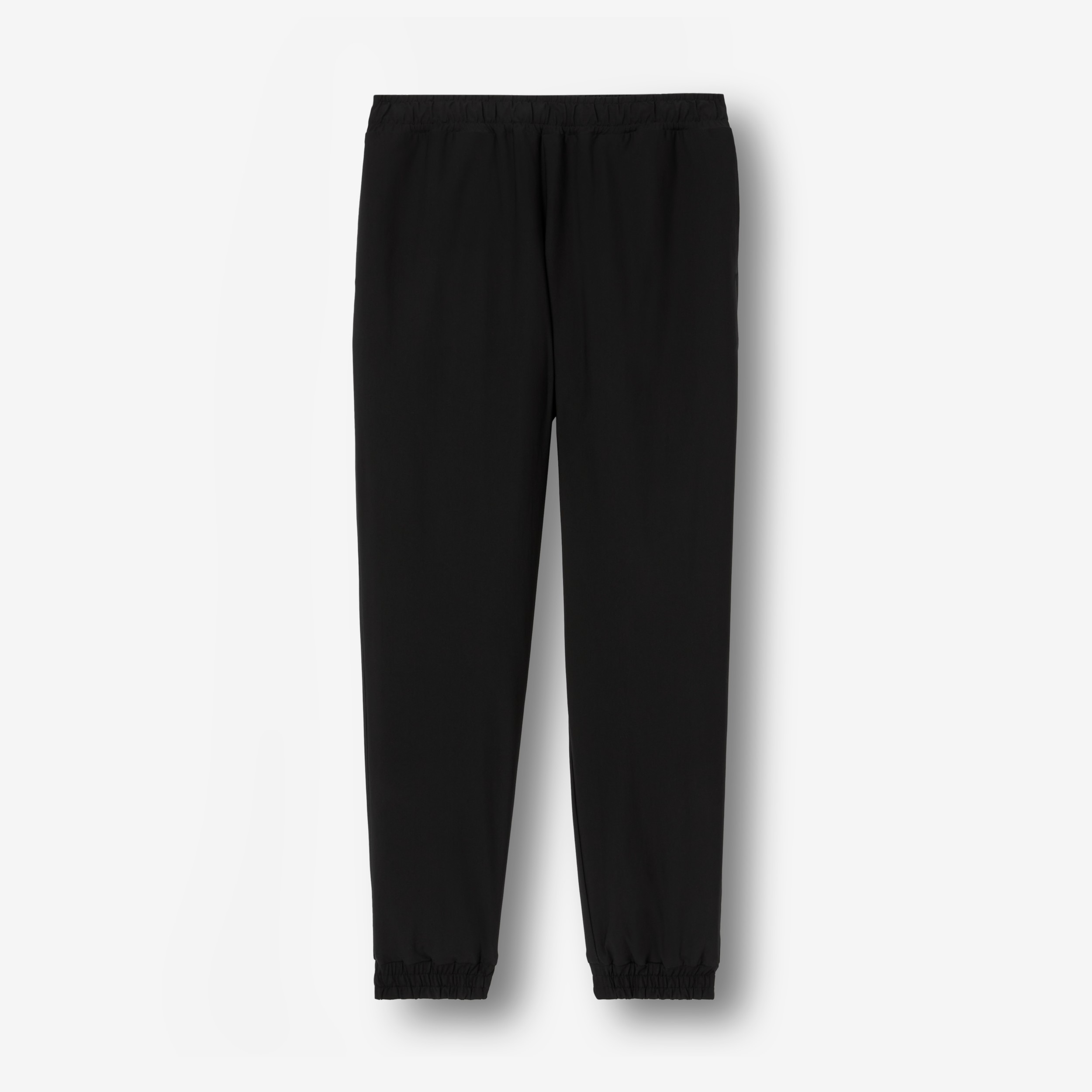 Logo Print Stretch Nylon Trousers in Black - Men | Burberry® Official - 1