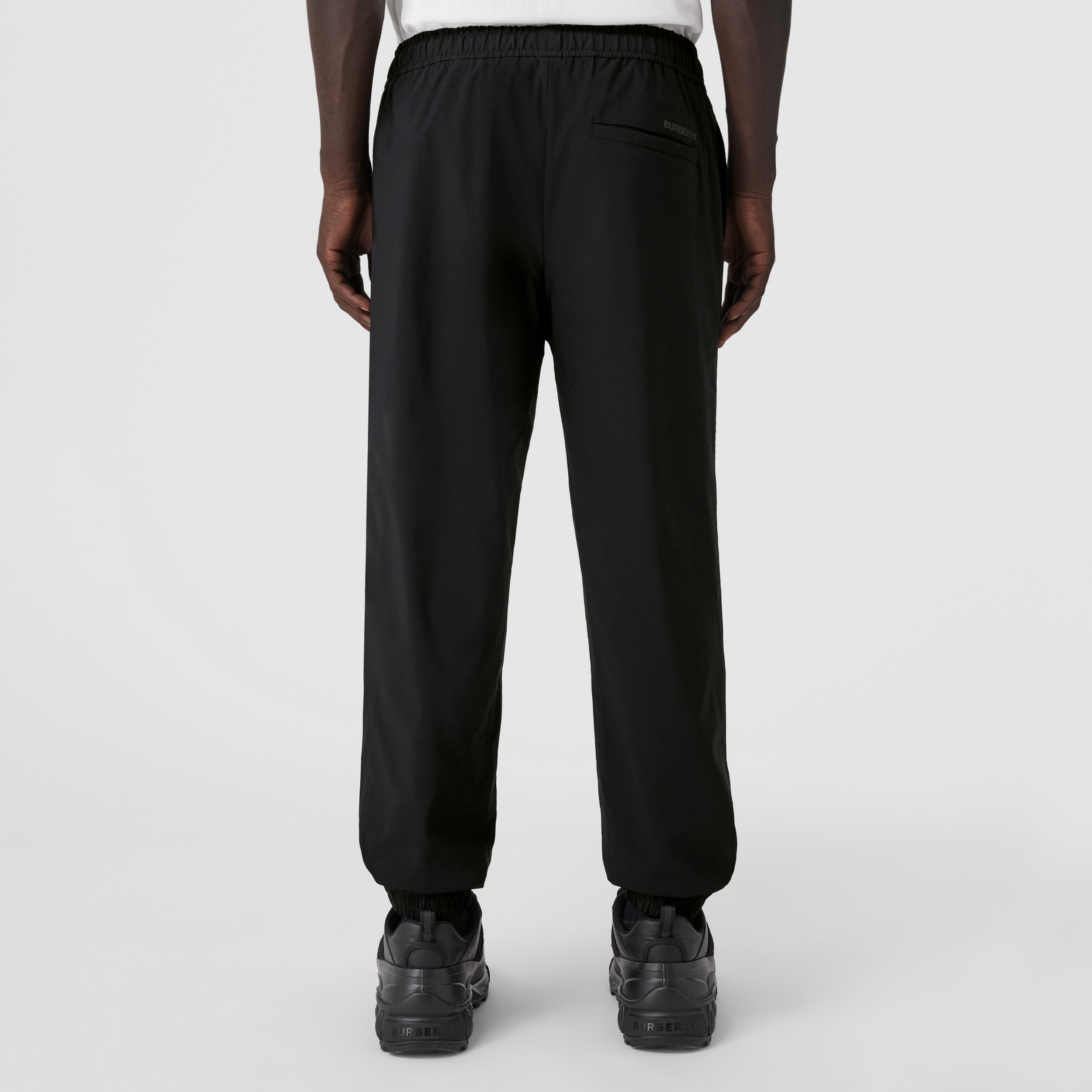 Logo Print Stretch Nylon Trousers in Black - Men | Burberry® Official - 3