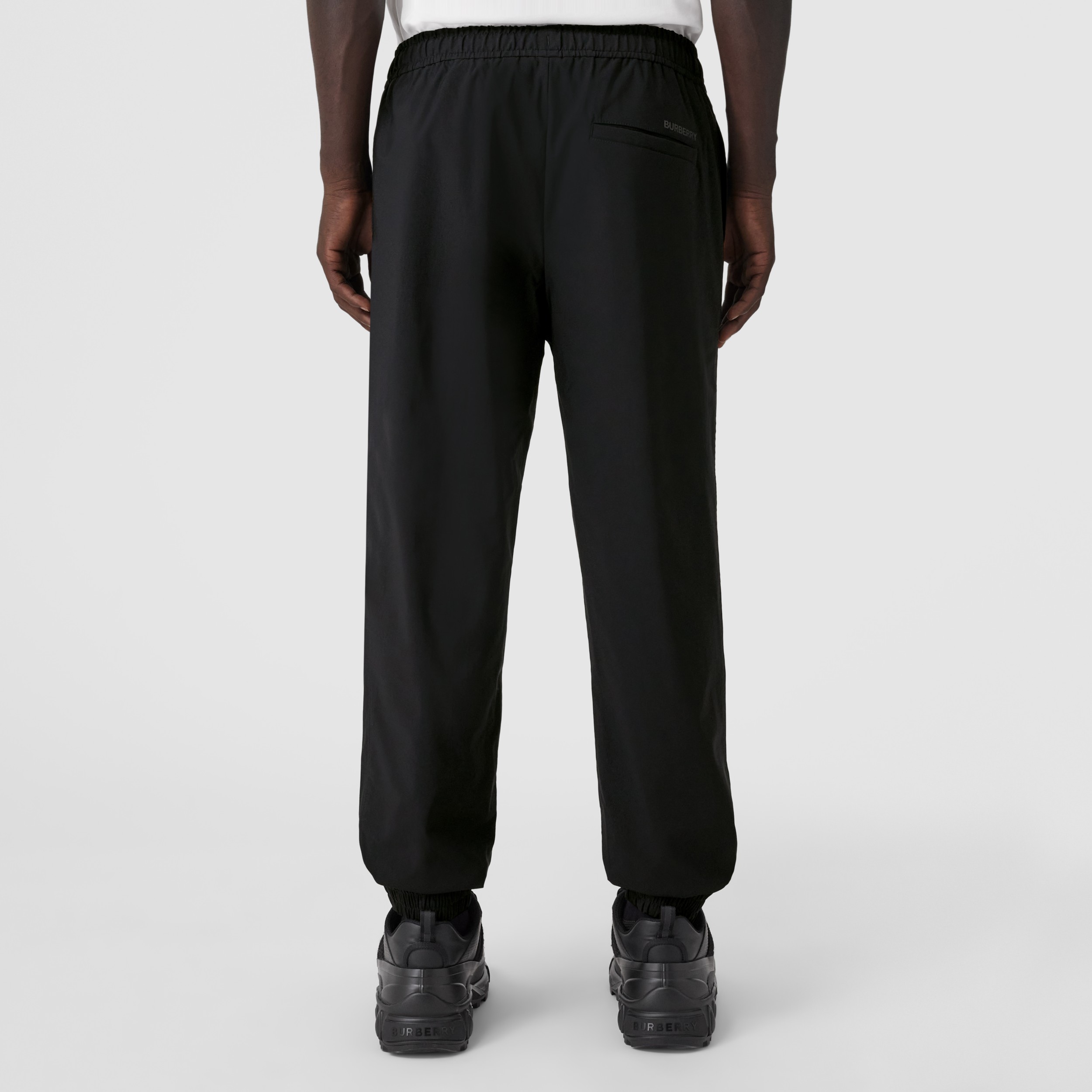 Logo Print Stretch Nylon Trousers in Black - Men | Burberry® Official - 3