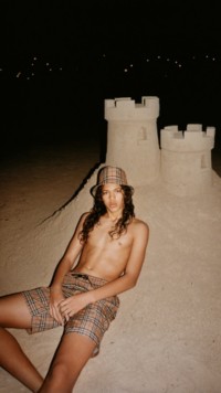 Summer campaign featuring model in Burberry check shorts
