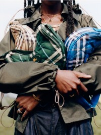 Shot of model holding Burberry Horsehoe Bags in colours Sand, Verdant and Hyacinth