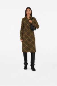 Model wearing Burberry Check Dress, holding B Clip Bag in colour Black