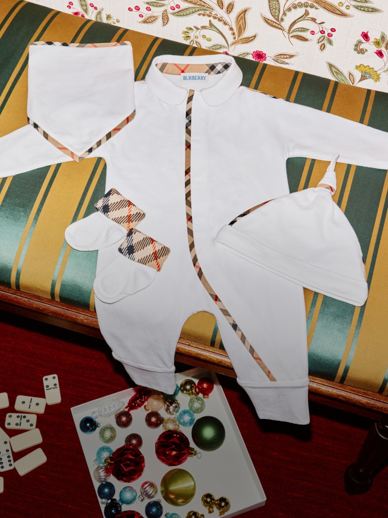 Burberry Festive Campaign featuring Burberry Childrenswear light beige headwear and gloves with check bow detail.