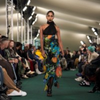 Model wearing Poppy garden print crepe dress.