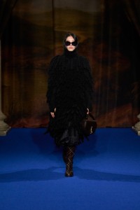 Hejia Li wearing a Fringed cape and Pleated skirt