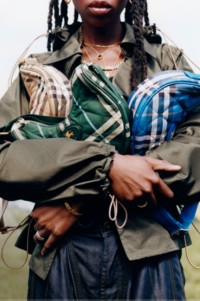 Model holding Women's quilted Horseshoe crossbody bags for Burberry Festival 2025