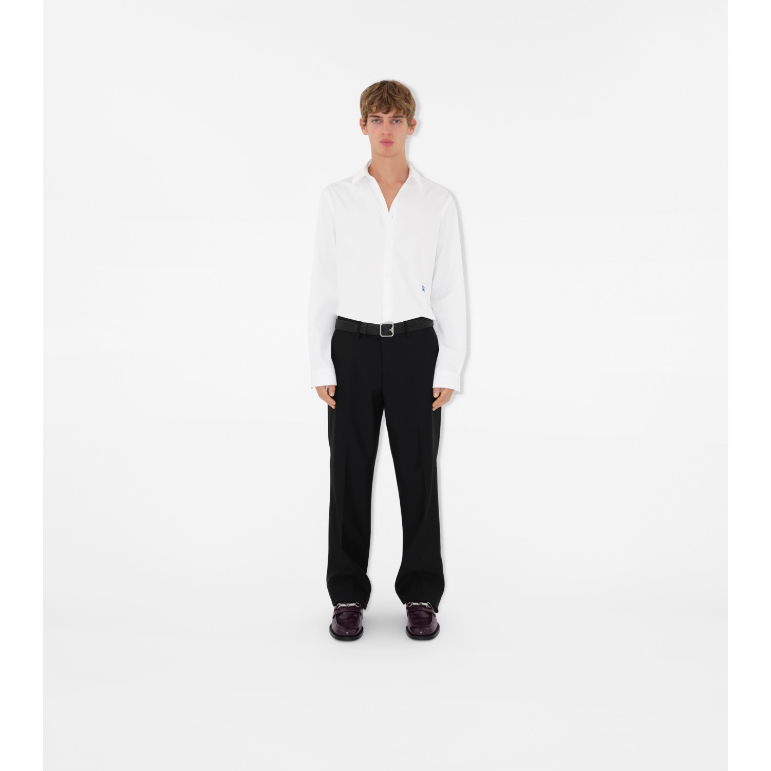 White cotton pants with embroidered detailing at hem by Free Living