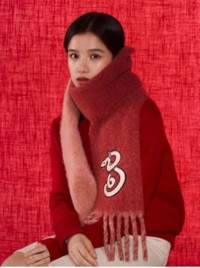 Woman wearing Burberry Cashmere Scarf for Lunar New Year 2025