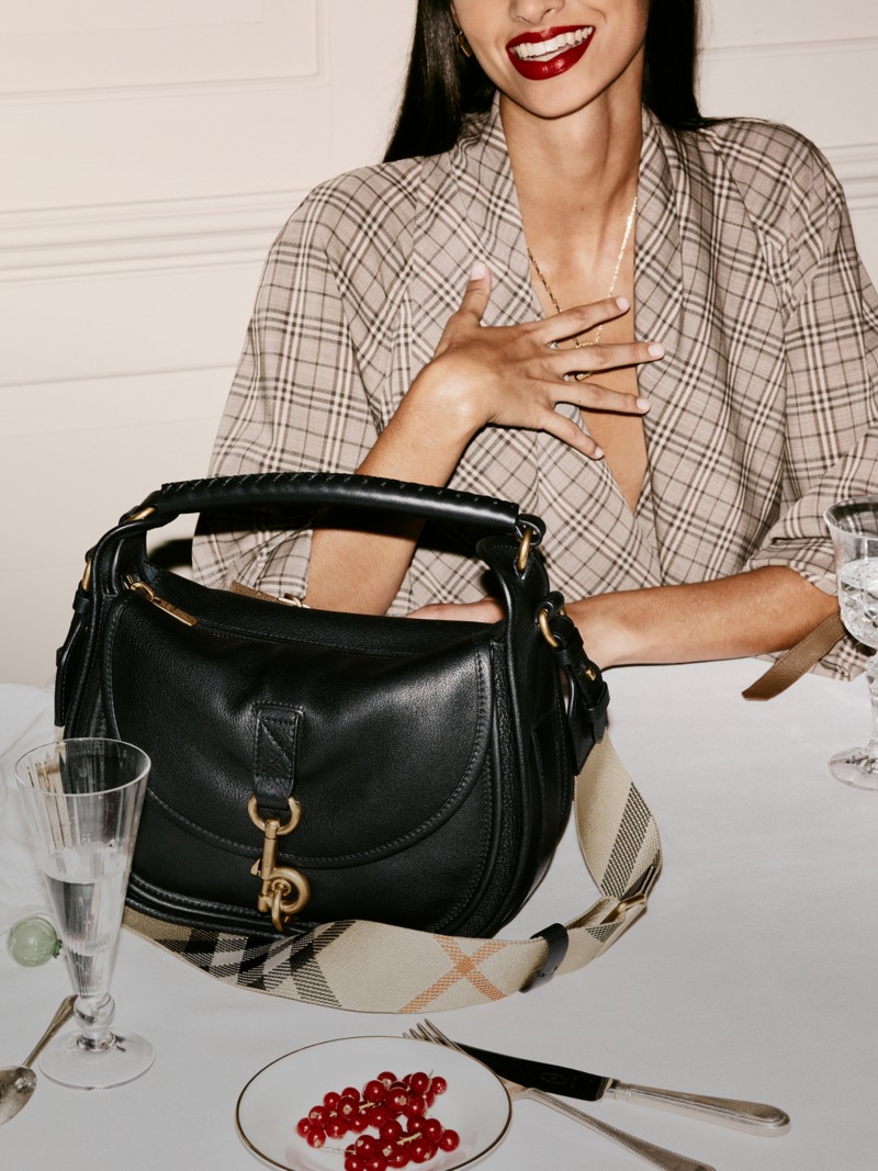 Burberry Festive Campaign featuring a B Clip Messenger Bag​ in Black. 