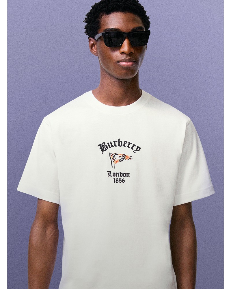Shot of model wearing Check Flag Cotton T-shirt in colour Chalk White