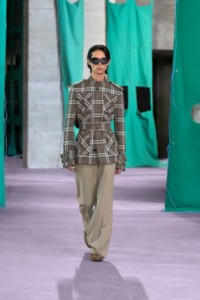 Model wearing Burberry Check linen cotton field jacket in nut and silk canvas tailored trousers in crater.