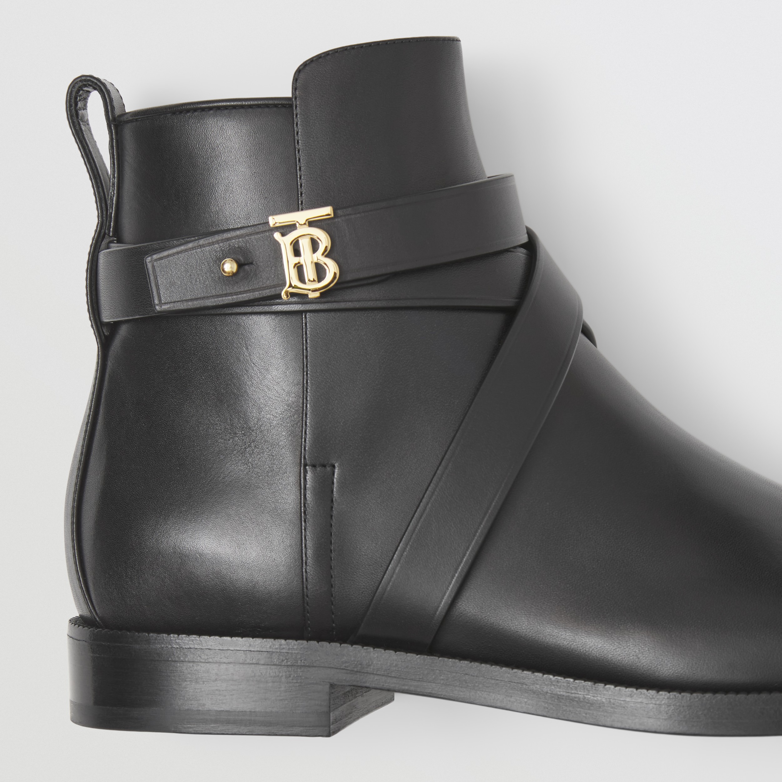 monogram buckle cleat ankle boots