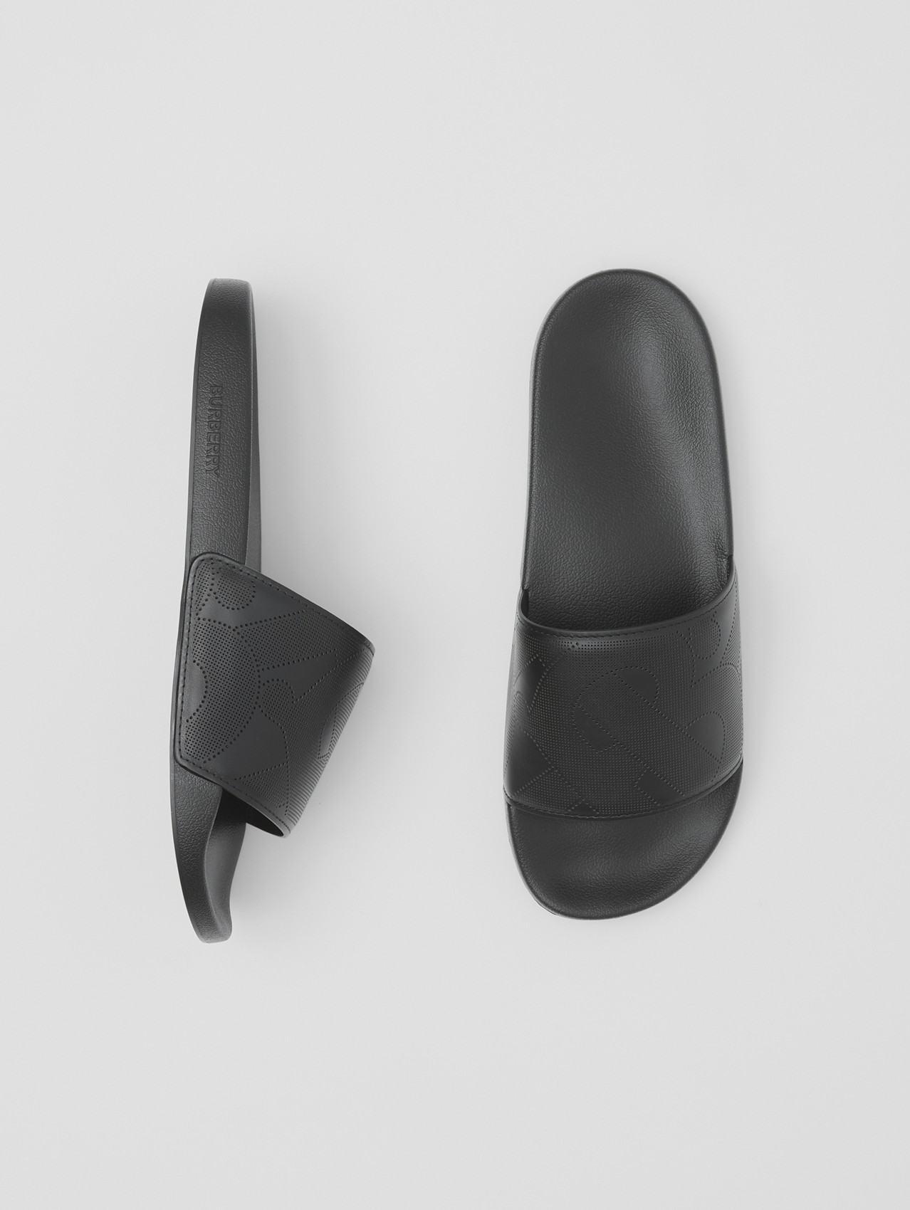 Perforated Monogram Leather Slides in Black