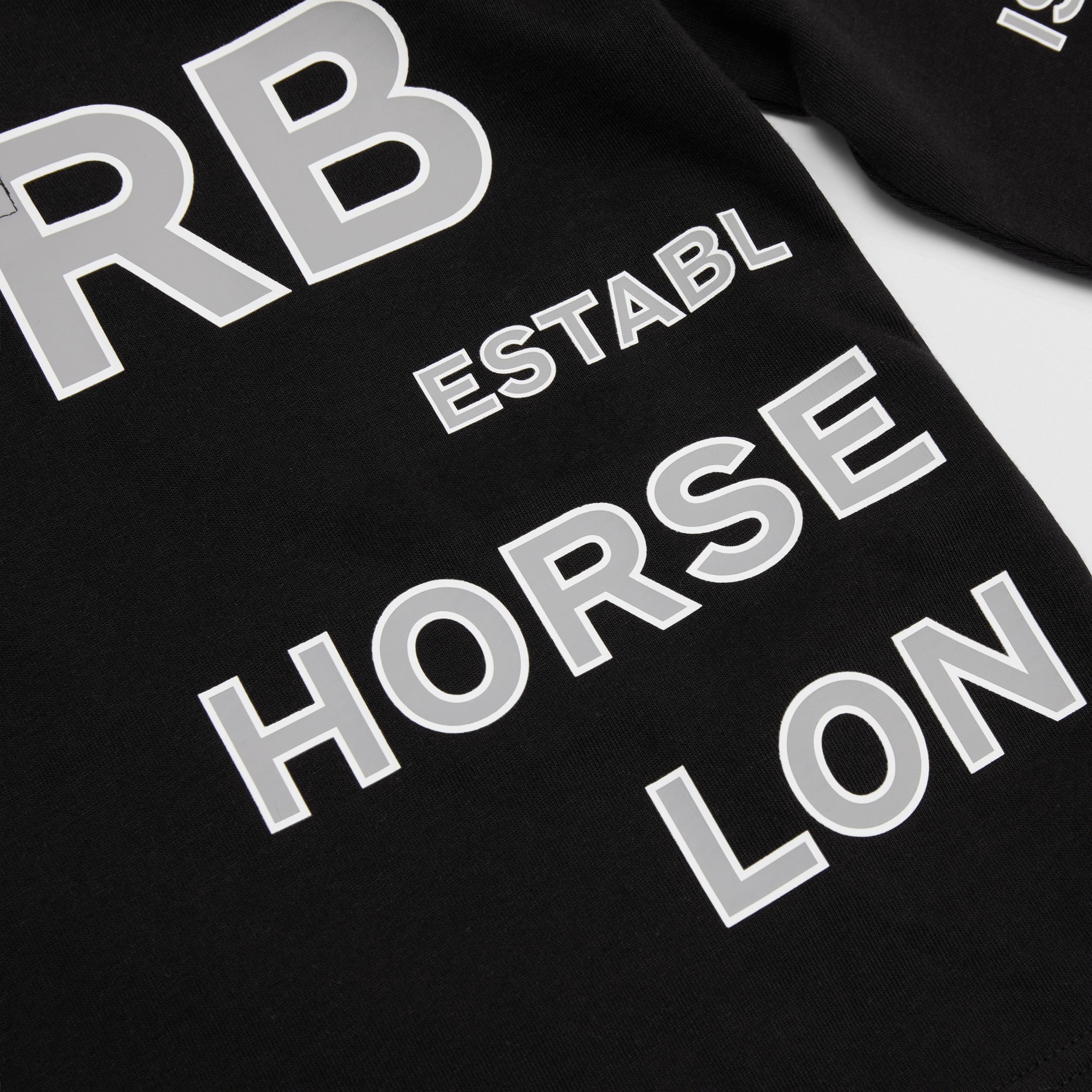 Langarm-Poloshirt aus Baumwolle mit Horseferry-Schriftzug (Schwarz) - Kinder | Burberry® - 2