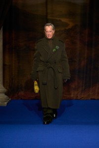 Richard E. Grant wearing Tailored coat, Rollneck sweater and Corduroy trousers