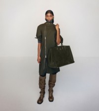 Model in Puttee collar dress and Rocking Horse tote