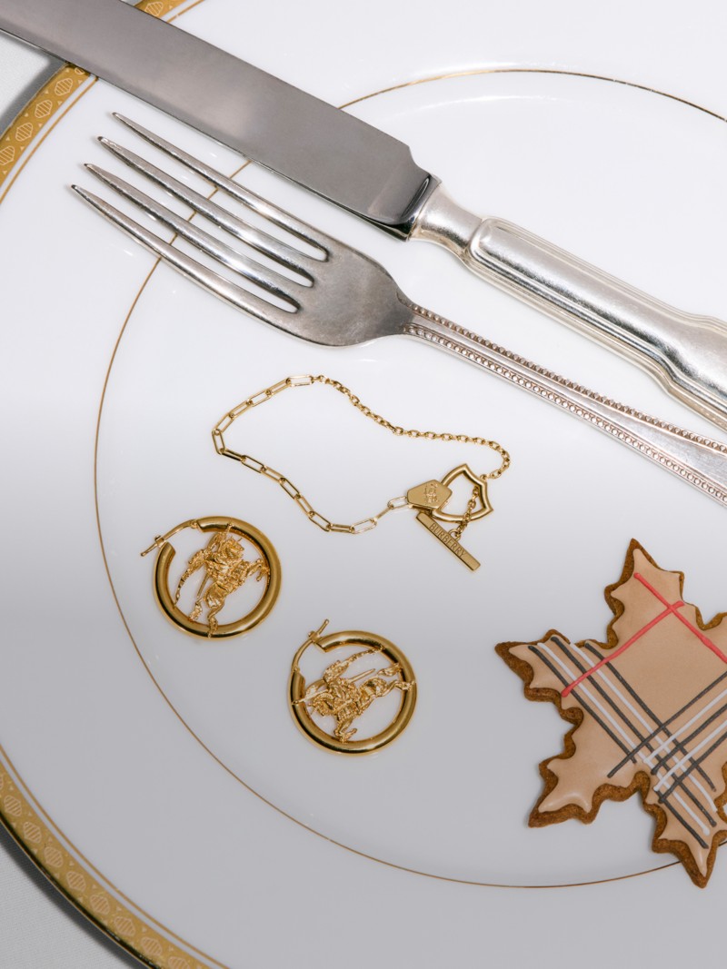 Burberry Festive Campaign featuring the EKD Hoop Earrings and other jewellery on a Festive dinner table. 