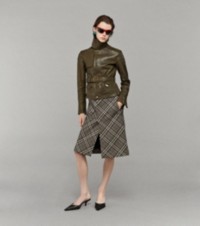 Model wearing Leather Jacket with a Burberry Check Skirt and Leather Mules