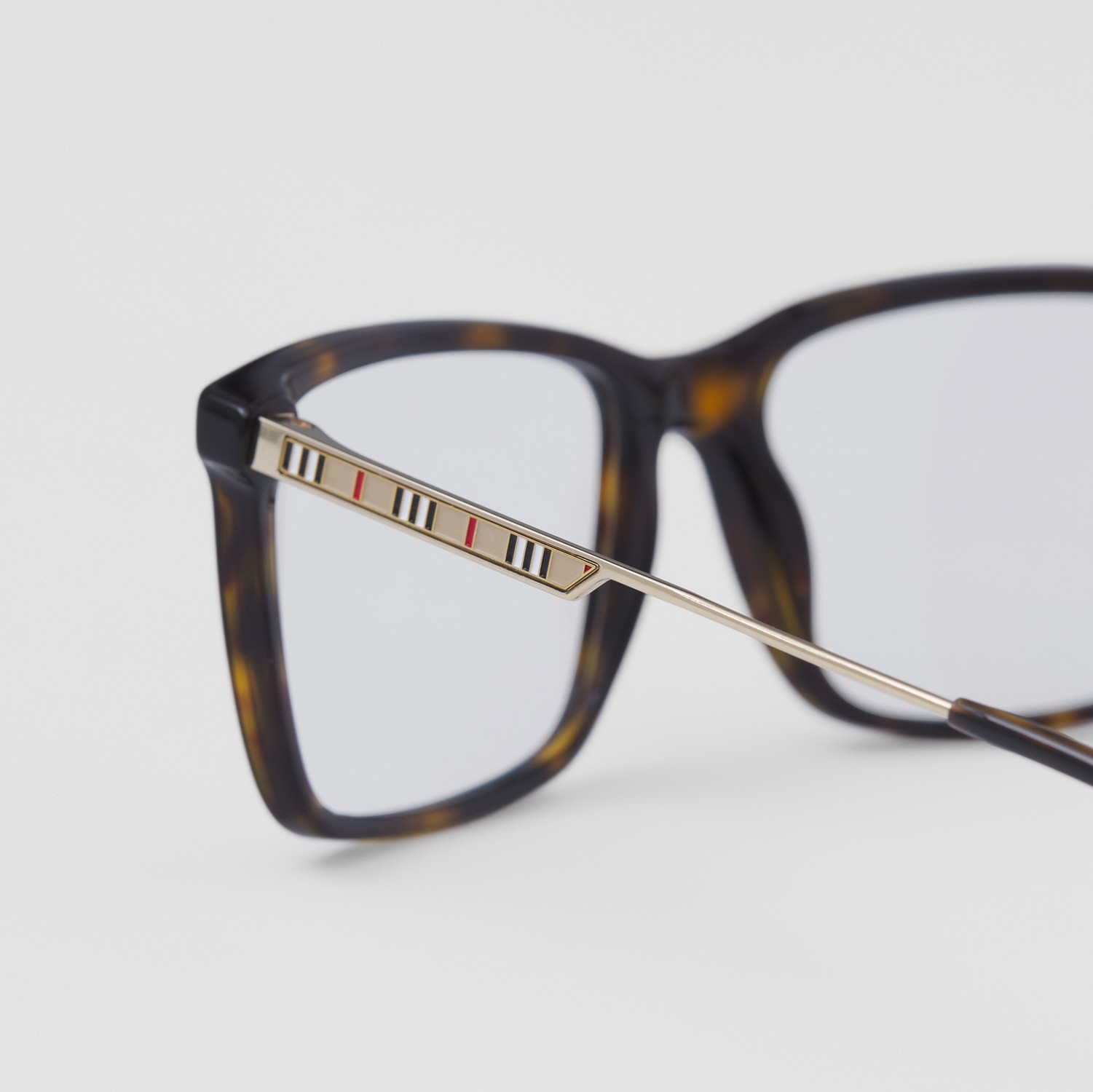 Monture rectangulaire à rayures iconiques pour lunettes de vue