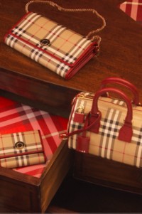 Burberry Check Cashmere Scarf placed on Red velvet chair 