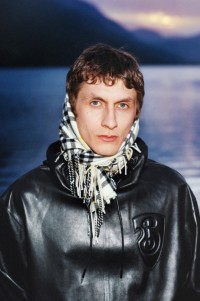 Model wearing Plongé Leather Hoodie in Black, with Burberry Check Scarf