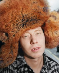 Model wears Faux fur oversized trapper hat in hunter