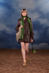 Burberry SS26 Show model Thelma Almqvist wearing a Fringed leather trench coat and a Fringed leather Equestrian Knight bag