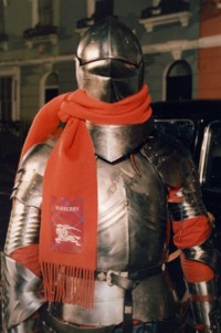 Knight who's featured in the London In Love 2025 Campaign, stood wearing Red Cashmere Scarf