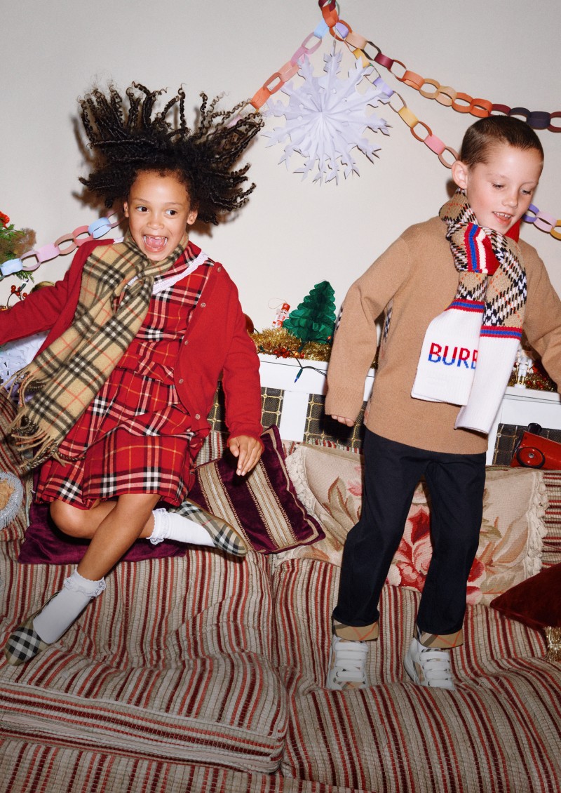 Burberry Festive Campaign featuring kids having fun during Festive celebrations wearing Burberry check Childrenswear clothes. 