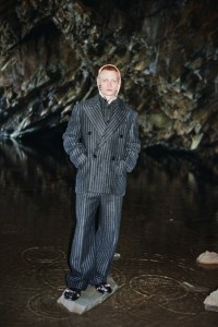 Model wearing Pinstripe Wool Double-breasted Tailored Jacket & Trousers in Black