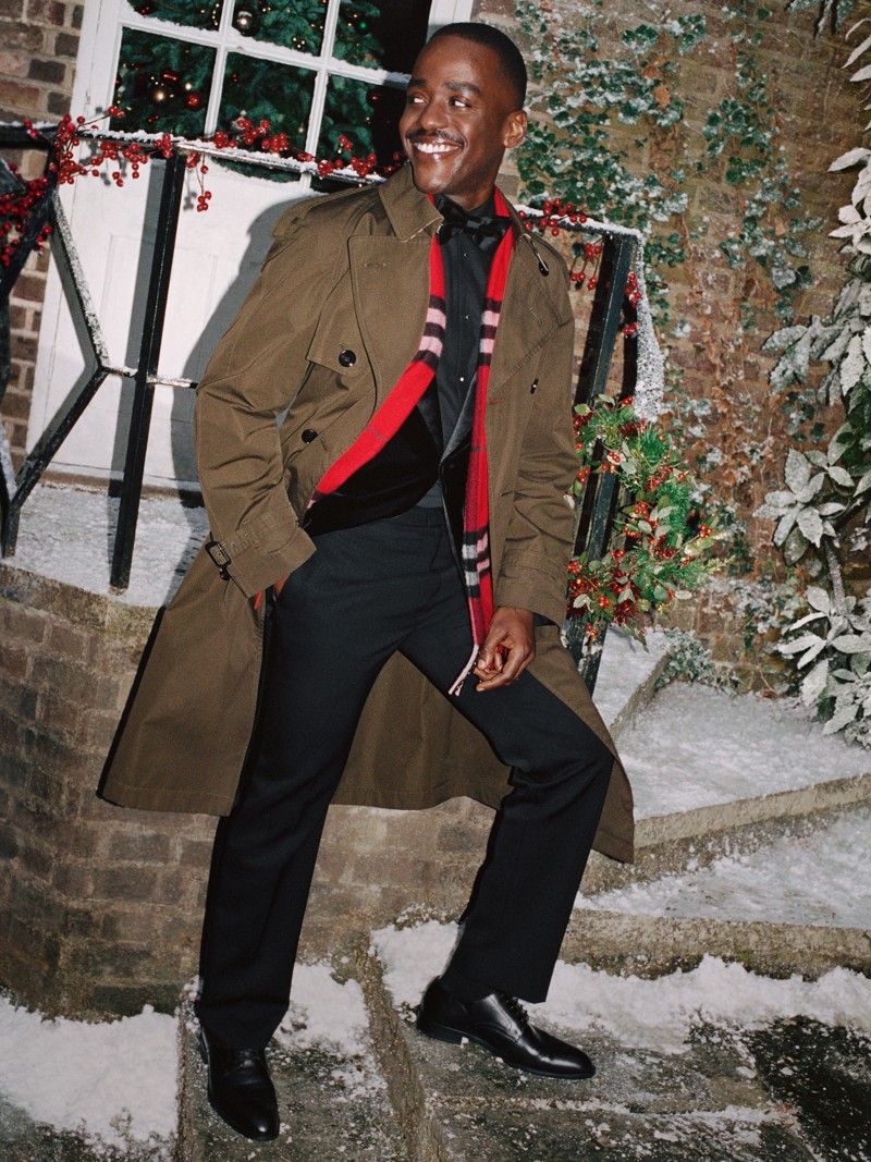 Burberry Festive Campaign featuring Ncuti Gatwa wearing a red check scarf. 