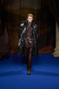 Finn Collins wearing leather parka, leather tailored jacket and Burberry Check boots