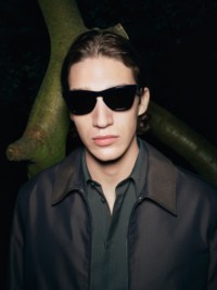 Summer 24 Model wearing Sunglasses and Trench Coat