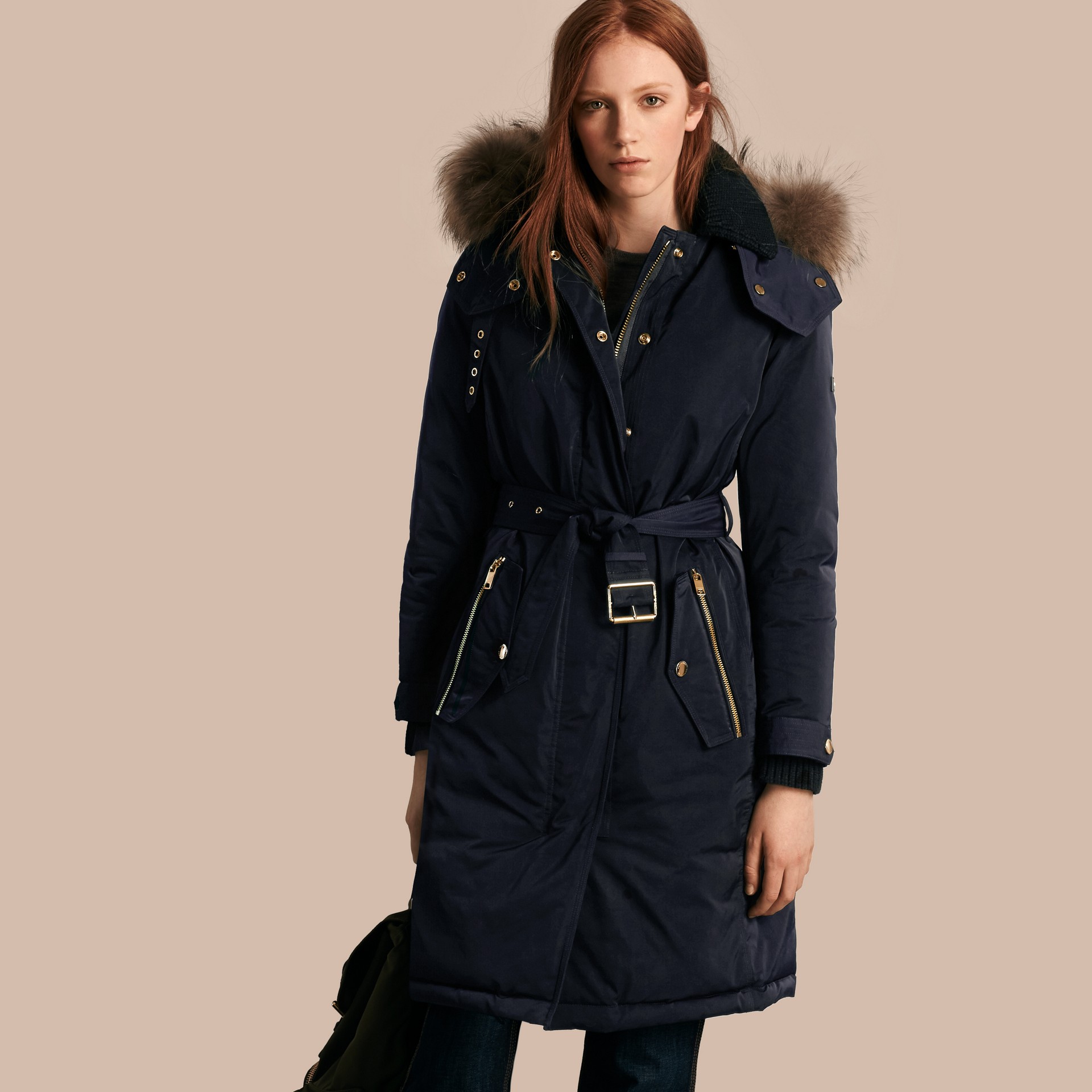 Coat with fur trim The main body of the coat is faux fur, but the trim around the collar, front, and sleeves is real fur. It is in great condition. We will make every attempt possible to resolve the issue if we made a m.