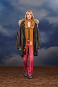 Burberry SS26 Show model Filip Bryndza wearing a Fringed waxed cotton parka and pink Coated denim jeans