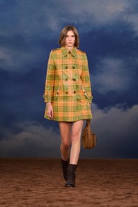 Burberry SS26 Show model Eden Kassner wearing a check coated trench coat and Ledger boots