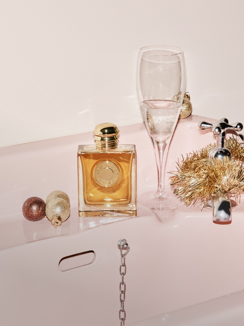 Burberry Festive Campaign featuring Goddess Eau de Parfum on a pink sink surrounded by Festive decorations. 