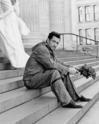 David Gandy wearing Burberry Check Two Piece while sitting on Church steps